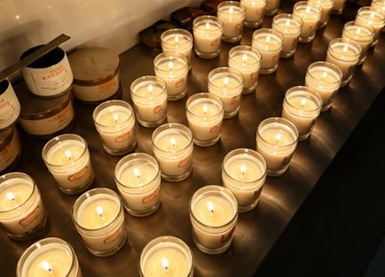 Lit candle production batch